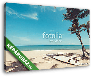 Surfboard on tropical beach in summer. landscape of summer beach and palm tree with sea, blue sky background. Vintage color tone - vászonkép 3D látványterv