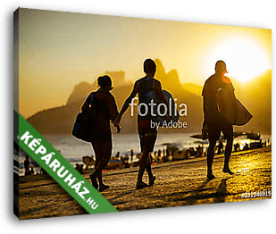 Scenic sunset silhouettes walking with surfboards along the boardwalk in front of Ipanema Beach in Rio de Janeiro, Brazil - vászonkép 3D látványterv