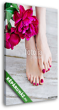 Feet with pink pedicure and peonies - vászonkép 3D látványterv