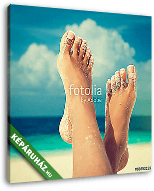 Tanned well-groomed feet amid tropical turquoise sea
 - vászonkép 3D látványterv
