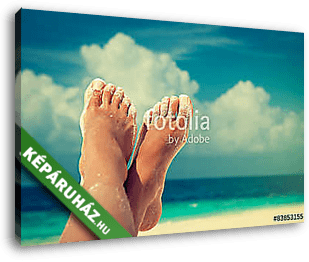 Tanned well-groomed feet amid tropical turquoise sea
 - vászonkép 3D látványterv