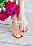 Feet with pink pedicure and peonies vászonkép, poszter vagy falikép