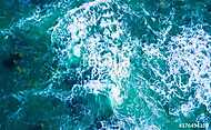 Drone view of waves hitting sea shore vászonkép, poszter vagy falikép