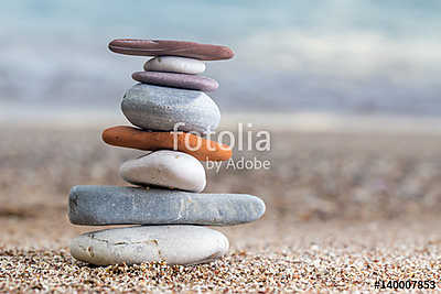 Pile of stacked stones on the sandy beach at Adriatic sea (fotótapéta) - vászonkép, falikép otthonra és irodába