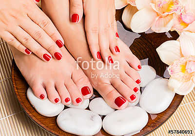 Beautiful female feet at spa salon on pedicure procedure (többrészes kép) - vászonkép, falikép otthonra és irodába