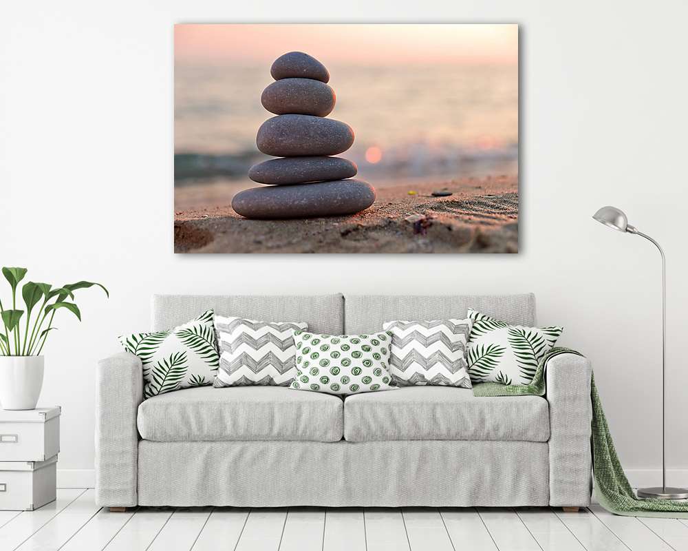 Stacked stones on the beach at sunset (többrészes kép) - vászonkép, falikép otthonra és irodába