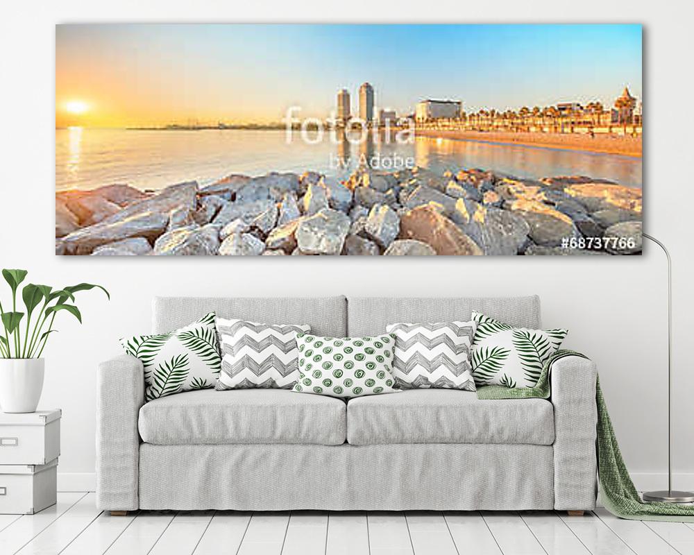 Barceloneta Beach in Barcelona at sunrise - vászonkép, falikép vásárlás Barceloneta Beach in Barcelona at sunrise (vászonkép) - vászonkép, falikép otthonra és irodába