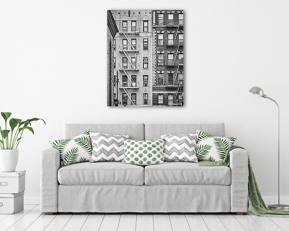 Black and white picture of residential buildings with fire escap (vászonkép) - vászonkép, falikép otthonra és irodába