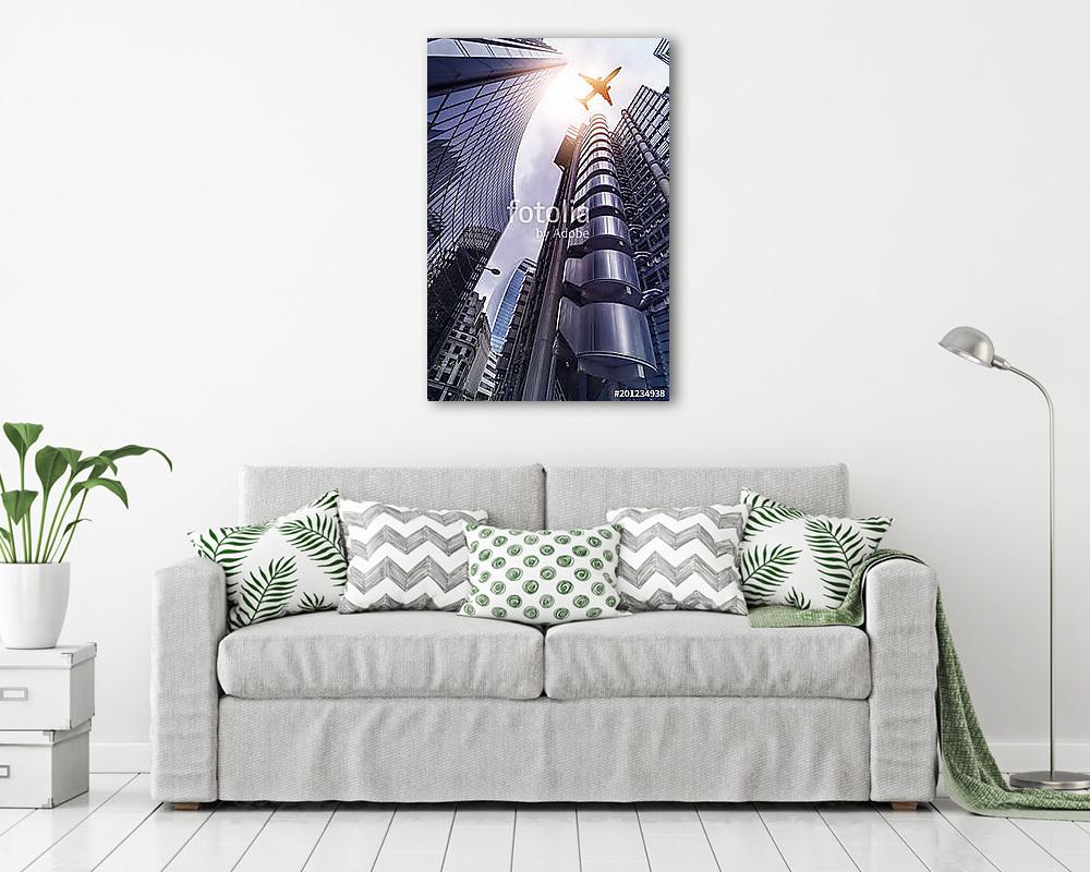 plane over highrise buildings (bögre) - vászonkép, falikép otthonra és irodába