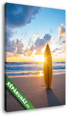 Surfboard on the beach at sunset - vászonkép 3D látványterv