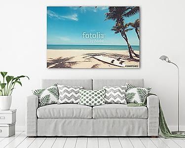 Surfboard on tropical beach in summer. landscape of summer beach and palm tree with sea, blue sky background. Vintage color tone (vászonkép) - vászonkép, falikép otthonra és irodába