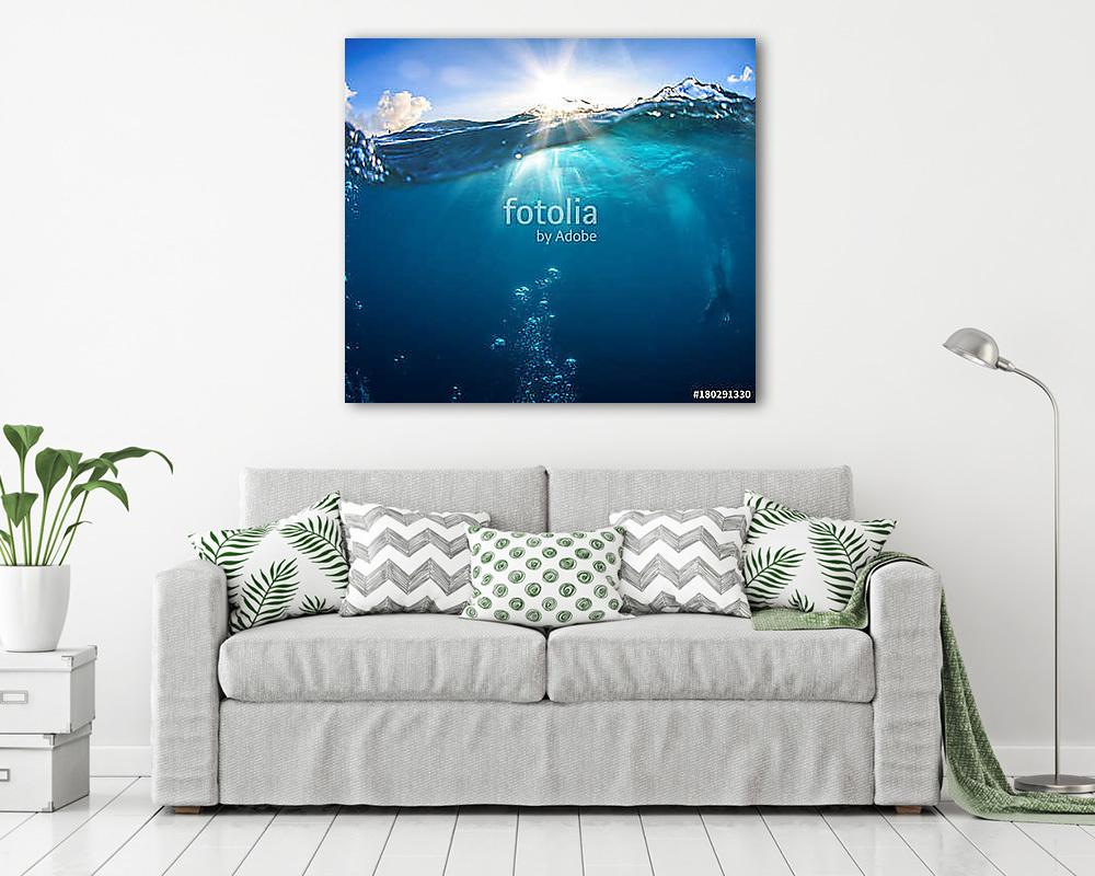 Underwater scenery, deep blue water of the ocean, air bubbles, waterline splitting skyline, divers discovering sea - vászonkép, falikép vásárlás Underwater scenery, deep blue water of the ocean, air bubbles, waterline splitting skyline, divers discovering sea (vászonkép) - vászonkép, falikép otthonra és irodába