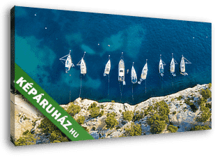 Yachts at the sea in France. Aerial view of luxury floating boat on transparent turquoise water at sunny day. Summer seascape fr - vászonkép 3D látványterv