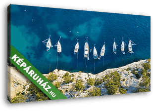 Yachts at the sea in France. Aerial view of luxury floating boat on transparent turquoise water at sunny day. Summer seascape fr - vászonkép 3D látványterv Yachts at the sea in France. Aerial view of luxury floating boat on transparent turquoise water at sunny day. Summer seascape fr - vászonkép 3D látványterv