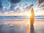 Surfboard on the beach at sunset (id: 16537) poszter