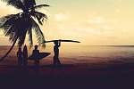 Art photo styles of silhouette surfer on beach at sunset - vintage color tone vászonkép, poszter vagy falikép