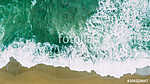 Waves near beach. Yellow sand and green water vászonkép, poszter vagy falikép