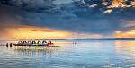 Balatoni naplemente, vizibiciklikkel és felhőkkel vászonkép, poszter vagy falikép