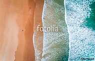 Aerial view of a man walking along a beach in Asturias vászonkép, poszter vagy falikép