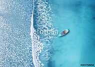 Wave and boat on the beach as a background. Beautiful natural background at the summer time from air vászonkép, poszter vagy falikép