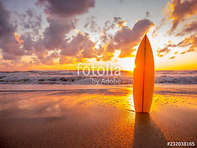 surfboard on the beach in sea shore at sunset time with beautiful light (keretezett kép) - vászonkép, falikép otthonra és irodába