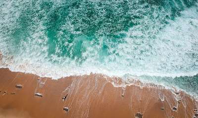 surfer on the beach top view. Drone shot on a beach in a summer day. (többrészes kép) - vászonkép, falikép otthonra és irodába