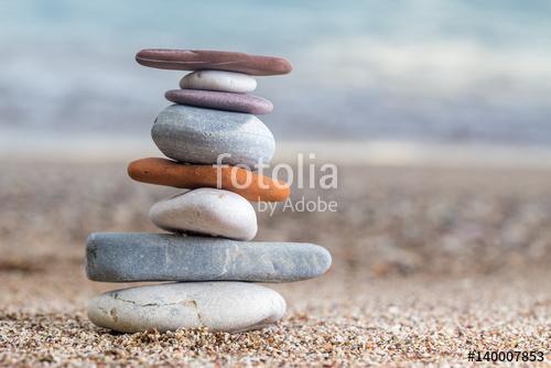 Pile of stacked stones on the sandy beach at Adriatic sea, Premium Kollekció