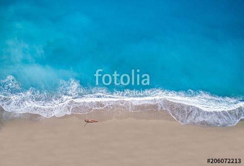 woman sunbathing lying down on the tropical beach, Premium Kollekció