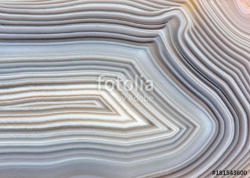 Amazing Banded Agate Crystal cross section as a background. Natural light translucent agate crystal surface, Gray abstract expre, Premium Kollekció