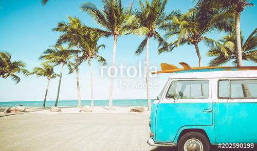 vintage car parked on the tropical beach (seaside) with a surfboard on the roof - Leisure trip in the summer. retro color effect, Premium Kollekció