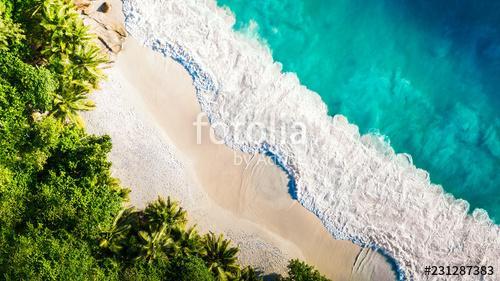 Tropical beach with sea and palm taken from drone. Seychelles famous shark beach - aerial photo, Premium Kollekció