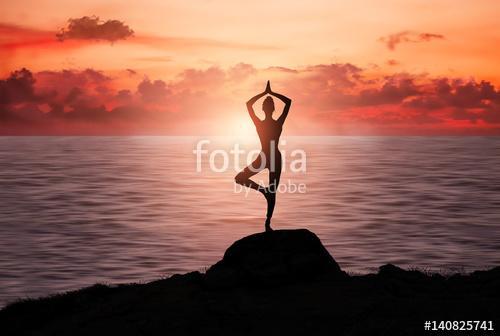 Silhouette of a girl practicing yoga , Premium Kollekció