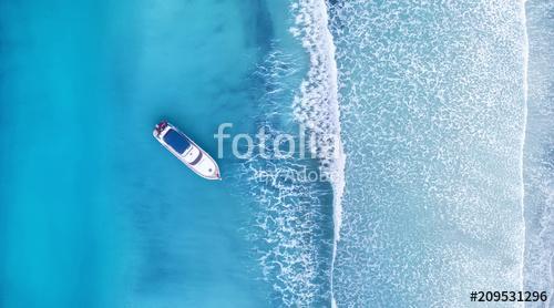 Wave and boat on the beach as a background. Beautiful natural background at the summer time from air, Premium Kollekció