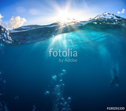 Underwater scenery, deep blue water of the ocean, air bubbles, waterline splitting skyline, divers discovering sea, Premium Kollekció